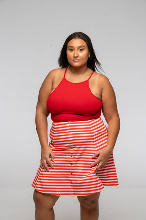 Popper Skirt Mini in Tomato Red on Bubblegum pink!  - Manners London
