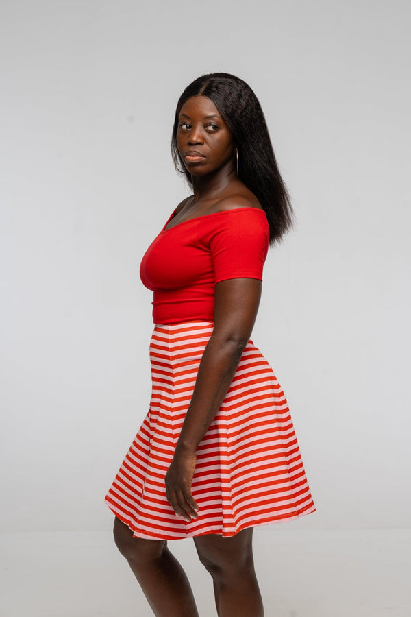 Popper Skirt Mini in Tomato Red on Bubblegum pink!  - Manners London